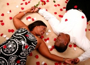 African American Couple Laying On The Floor With Rose Petal 2